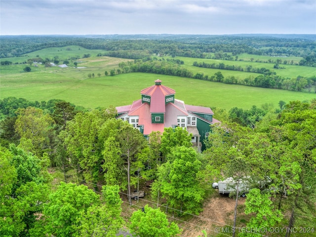 birds eye view of property with a rural view