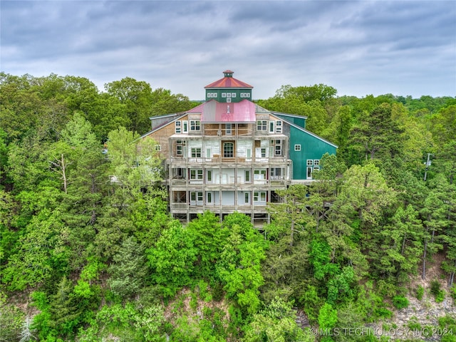 rear view of house with a balcony