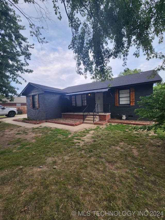 view of front of home with a front lawn