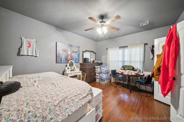 bedroom featuring ceiling fan and dark hardwood / wood-style flooring