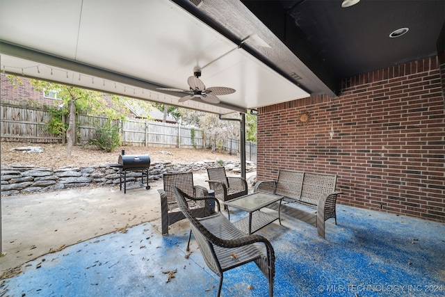 view of patio with ceiling fan and grilling area