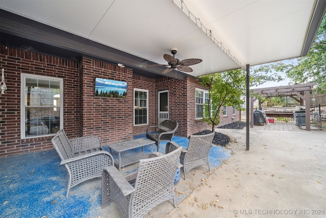 view of patio with ceiling fan and a pergola