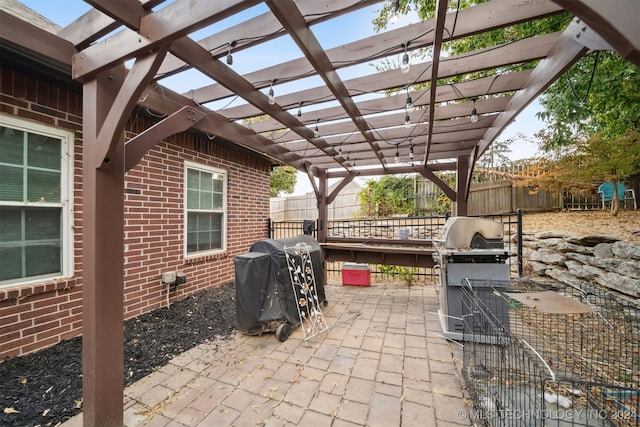 view of patio featuring a pergola and a grill