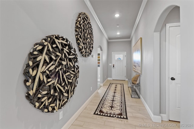 interior space with crown molding and light hardwood / wood-style flooring