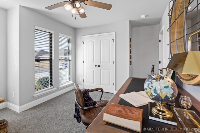 carpeted office with ceiling fan and a wealth of natural light