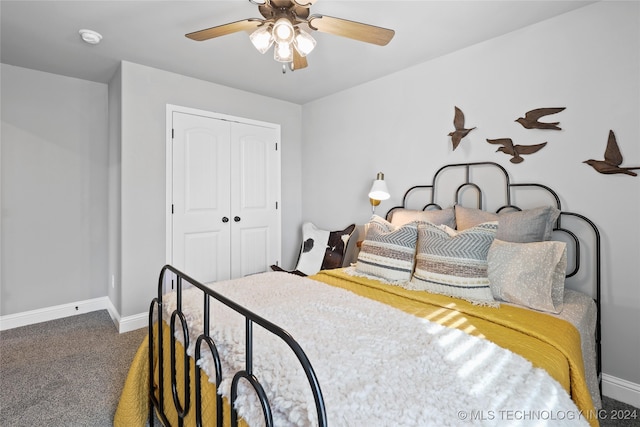 carpeted bedroom with a closet and ceiling fan