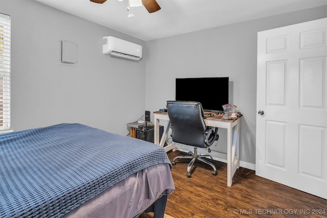 bedroom featuring dark wood-type flooring, ceiling fan, and a wall mounted air conditioner