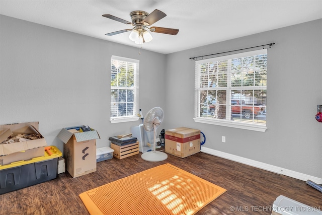 recreation room featuring ceiling fan and dark hardwood / wood-style floors