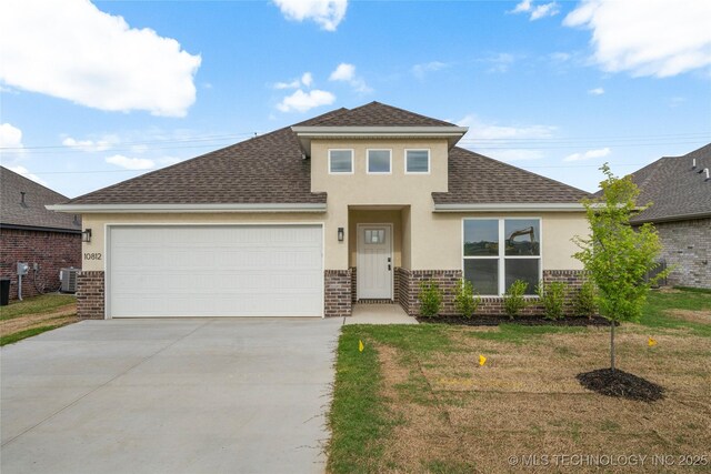10812 S 274th Ave E, Coweta, OK 74014 - view of front of house with brick siding, central AC unit, stucco siding, a shingled roof, and driveway