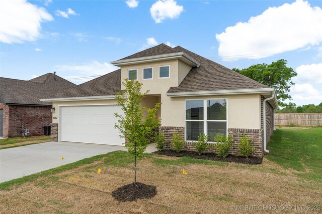 10812 S 274th Ave E, Coweta, OK 74014 - view of front facade featuring stucco siding, a shingled roof, brick siding, a garage, and concrete driveway