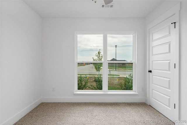 10812 S 274th Ave E, Coweta, OK 74014 - spare room with plenty of natural light, light carpet, and baseboards