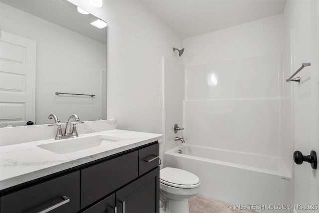 10812 S 274th Ave E, Coweta, OK 74014 - bathroom featuring vanity, toilet, shower / tub combination, and wood finished floors
