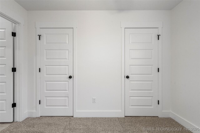 10812 S 274th Ave E, Coweta, OK 74014 - unfurnished bedroom featuring carpet flooring and baseboards