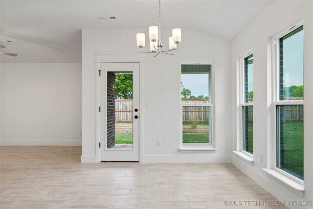 10812 S 274th Ave E, Coweta, OK 74014 - doorway featuring a chandelier, lofted ceiling, wood finished floors, baseboards, and ceiling fan