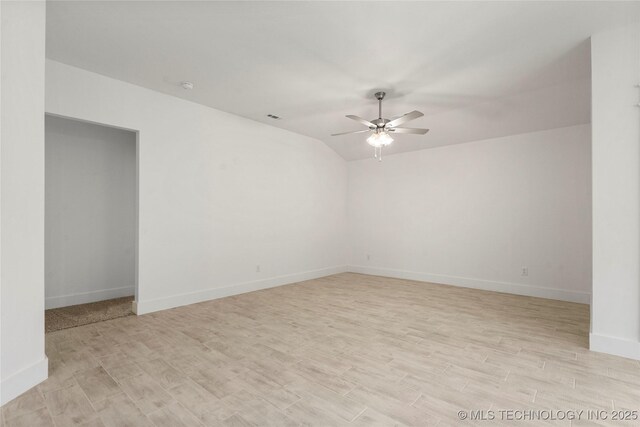 10812 S 274th Ave E, Coweta, OK 74014 - unfurnished room featuring ceiling fan, light wood-style flooring, baseboards, and lofted ceiling