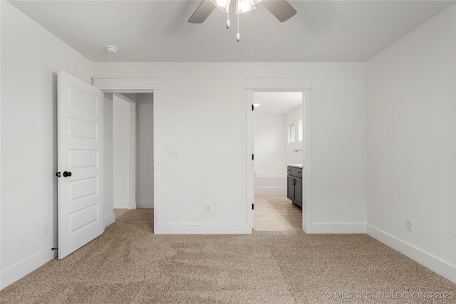 10812 S 274th Ave E, Coweta, OK 74014 - unfurnished bedroom with light colored carpet, baseboards, ensuite bath, and a ceiling fan
