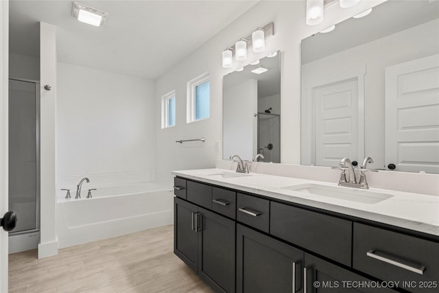 10812 S 274th Ave E, Coweta, OK 74014 - full bath featuring a bath, double vanity, a walk in shower, and wood finished floors