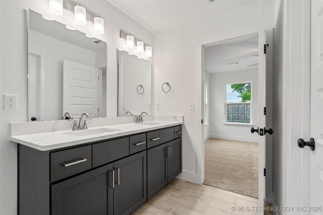 10812 S 274th Ave E, Coweta, OK 74014 - full bath with double vanity and baseboards