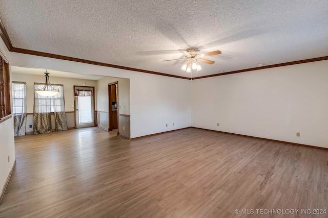 spare room with ceiling fan, a textured ceiling, crown molding, and light hardwood / wood-style floors