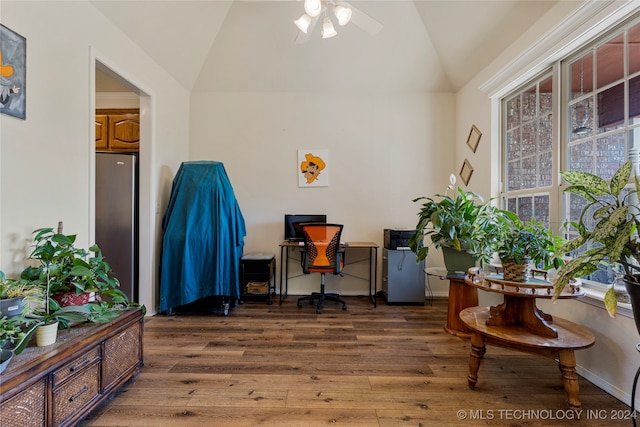 office space featuring ceiling fan, lofted ceiling, and dark hardwood / wood-style flooring