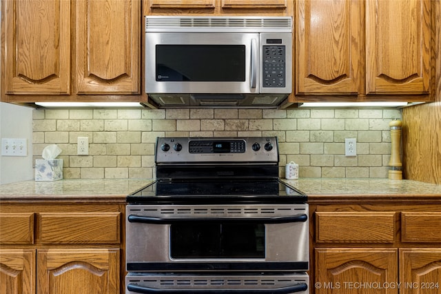 kitchen featuring backsplash and appliances with stainless steel finishes