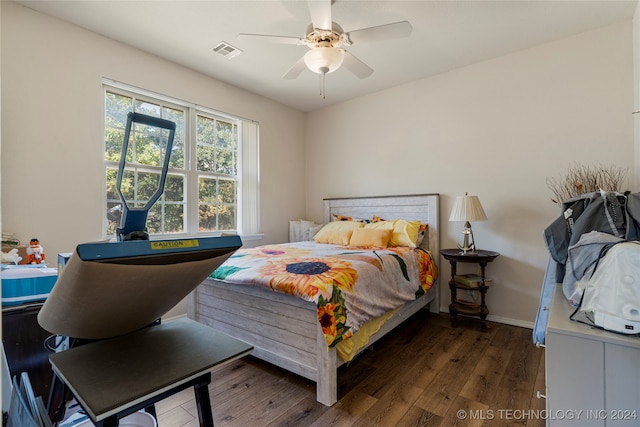 bedroom with dark wood-type flooring and ceiling fan