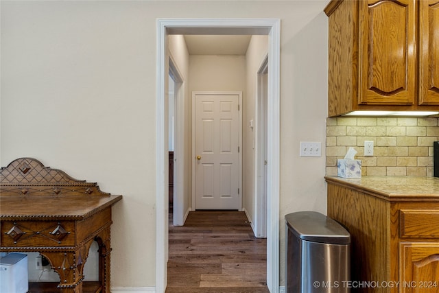 hallway featuring dark hardwood / wood-style flooring