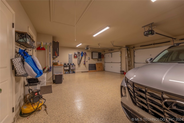 garage featuring a garage door opener