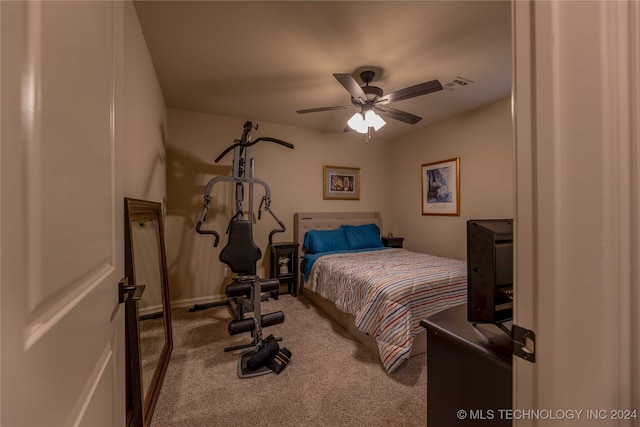 bedroom with ceiling fan and carpet floors