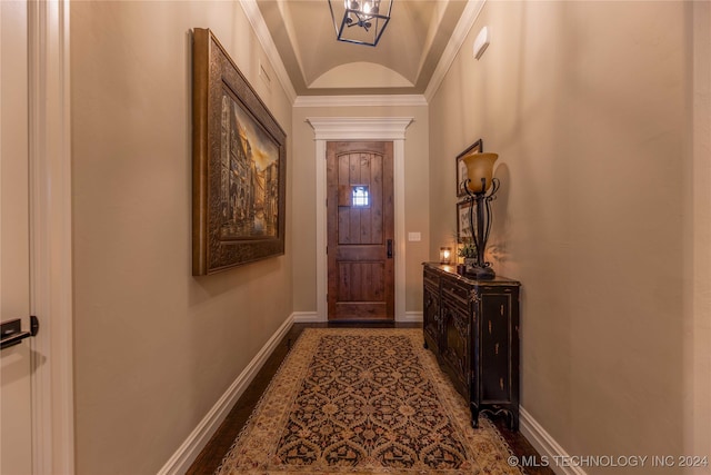 doorway to outside featuring ornamental molding