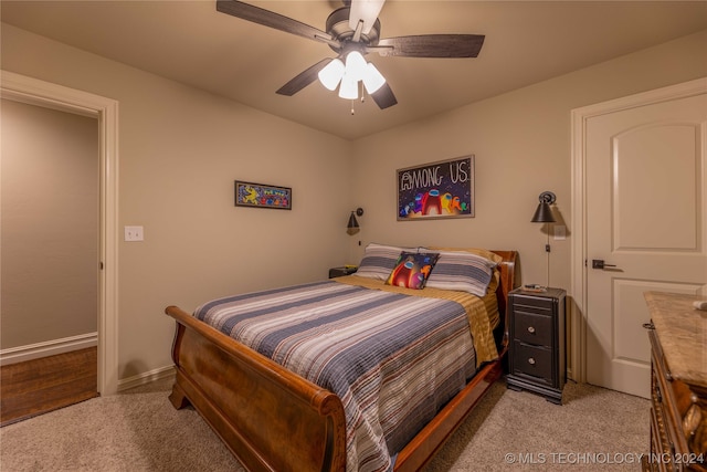 bedroom featuring ceiling fan and light colored carpet