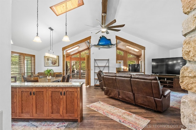 kitchen featuring hanging light fixtures, dark hardwood / wood-style flooring, a wealth of natural light, and ceiling fan