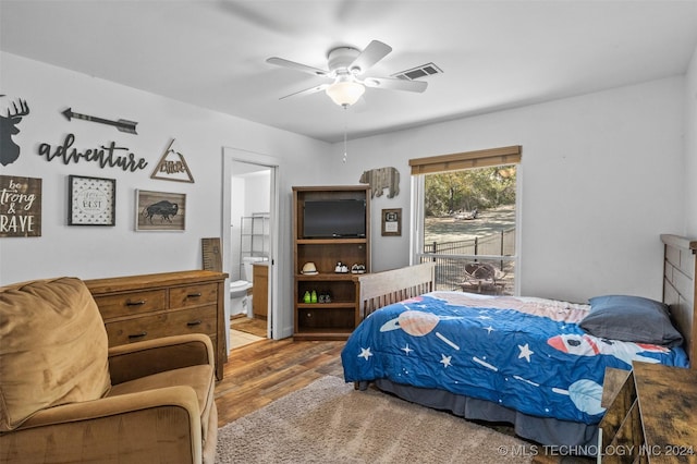 bedroom featuring wood-type flooring, connected bathroom, and ceiling fan