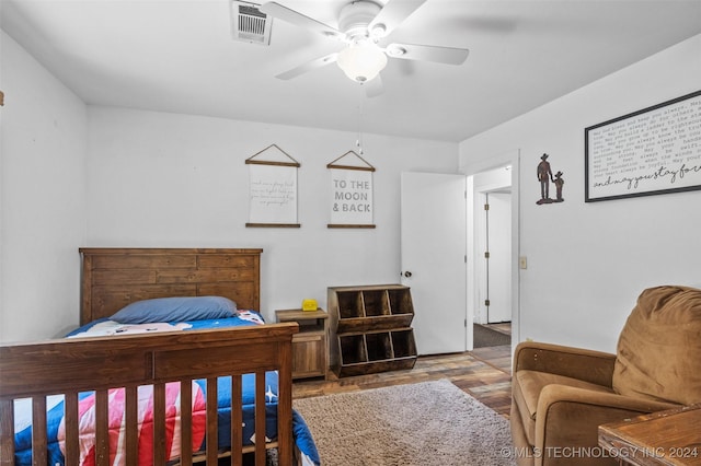 bedroom with ceiling fan and light wood-type flooring