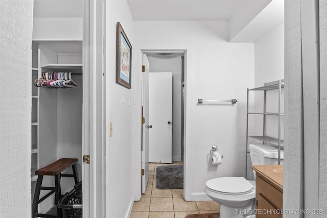 bathroom with tile patterned floors, vanity, and toilet