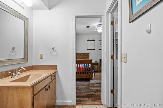 bathroom with vanity and wood-type flooring