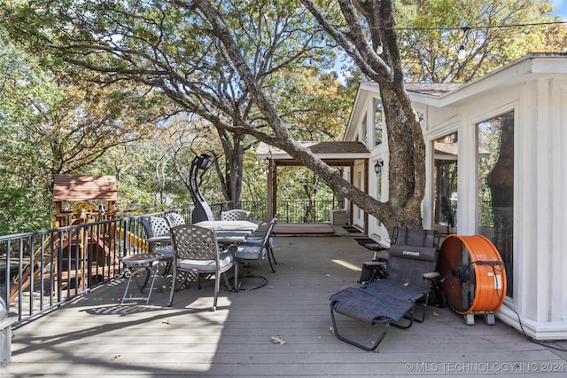 wooden terrace with area for grilling