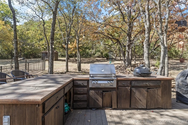 deck with a grill and area for grilling