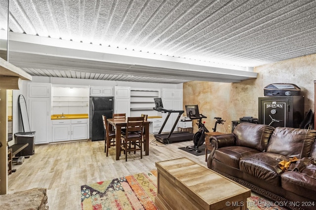 living room featuring light wood-type flooring and sink