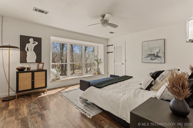 bedroom featuring visible vents and hardwood / wood-style floors