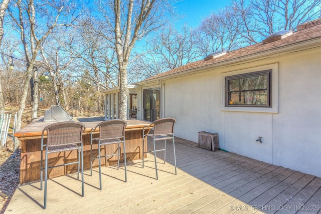 deck featuring outdoor dry bar