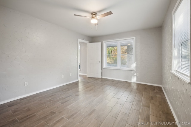 unfurnished room featuring ceiling fan and wood-type flooring