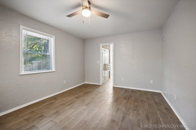 spare room featuring ceiling fan and hardwood / wood-style flooring