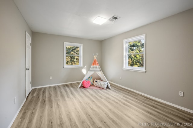 recreation room with plenty of natural light and light wood-type flooring