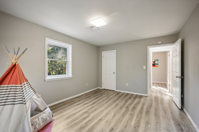 unfurnished bedroom featuring light hardwood / wood-style floors