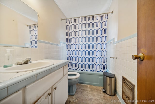 full bathroom with shower / bath combo with shower curtain, toilet, vanity, and tile walls