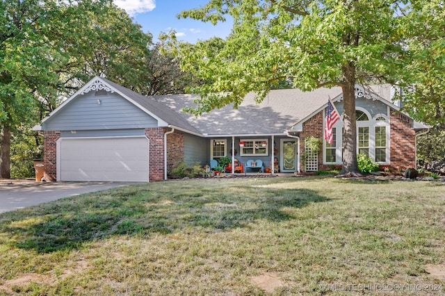 view of front of house featuring a front yard and a garage