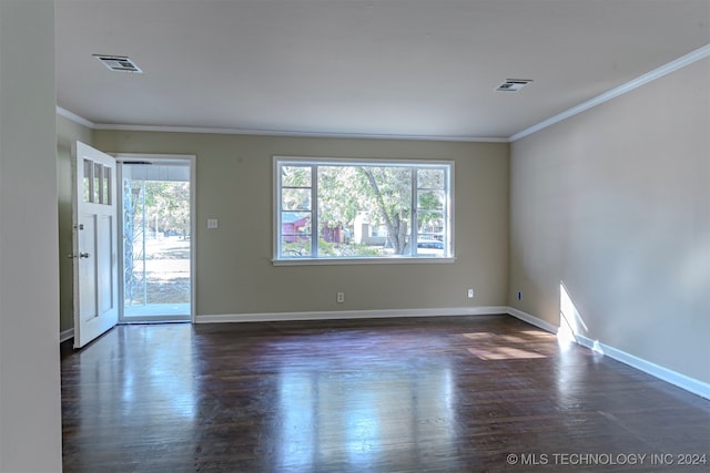 unfurnished room featuring dark hardwood / wood-style floors and ornamental molding