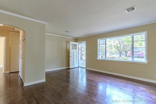 unfurnished room with crown molding and dark hardwood / wood-style flooring