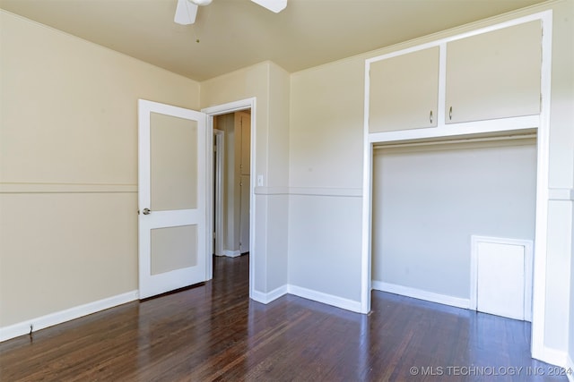 unfurnished bedroom featuring a closet, dark hardwood / wood-style flooring, and ceiling fan